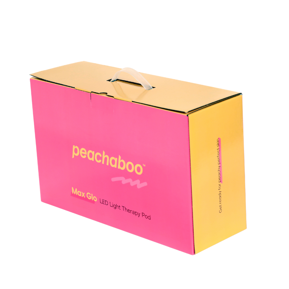 A colorful yellow and pink box featuring a barcode, labeled as "Peachaboo LED Light Therapy Pod."