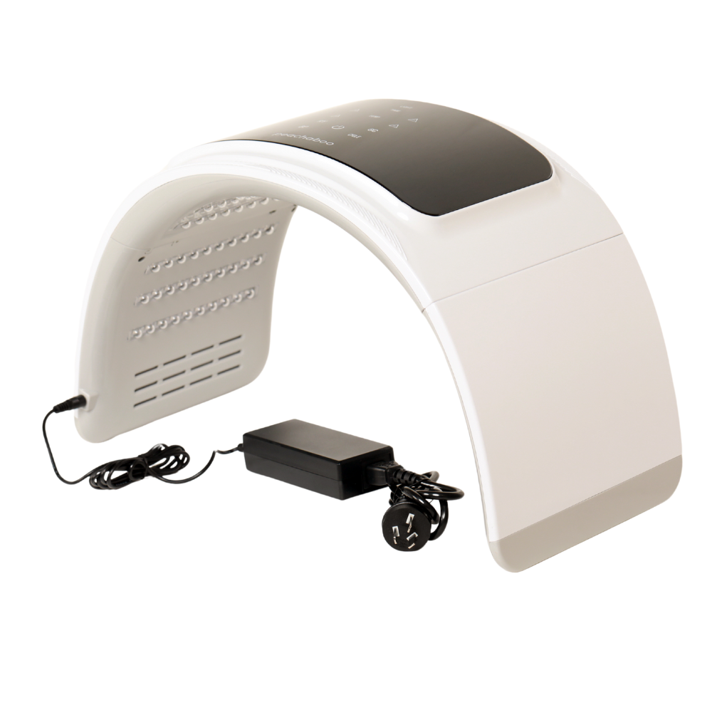 A white head lamp with a power cord, designed for the Peachaboo LED Light Therapy Pod to enhance light therapy treatments.